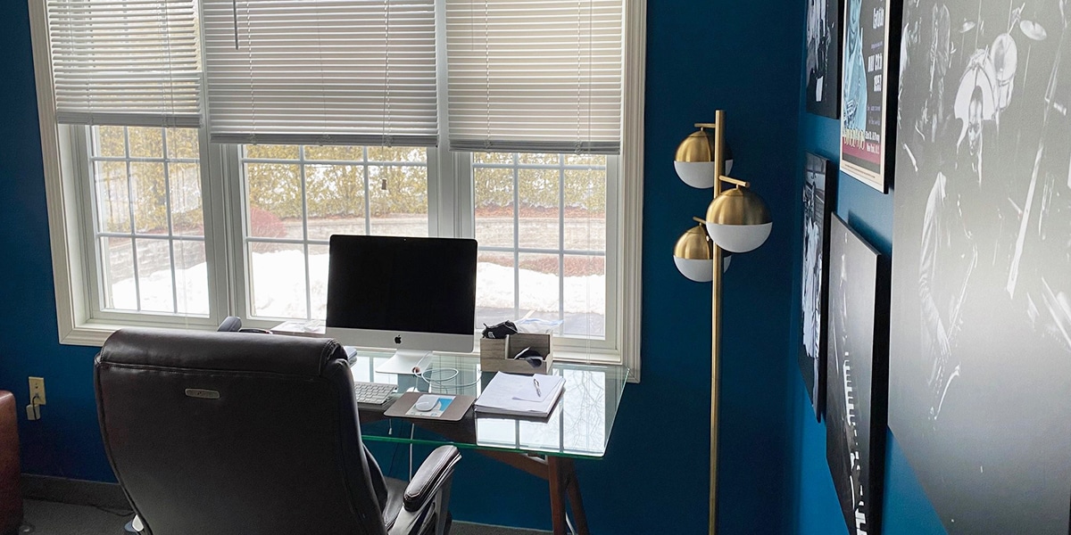 office with blue walls and brown leather chair