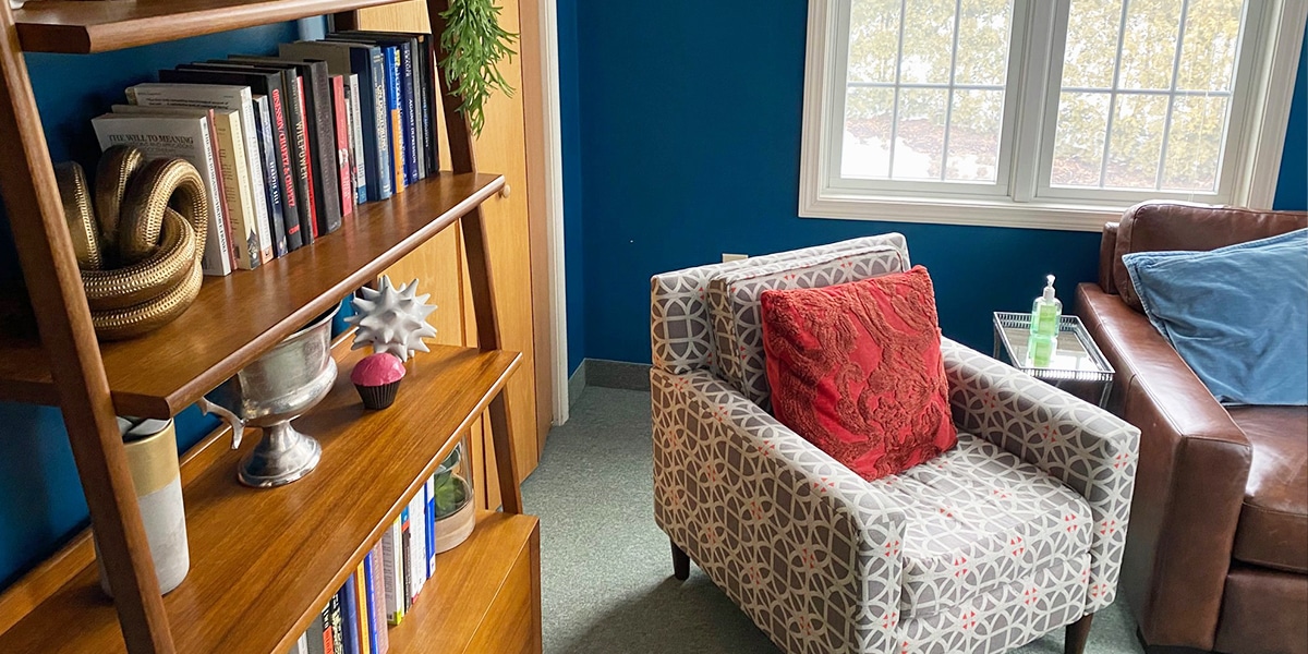 room with comfortable chairs and book shelf