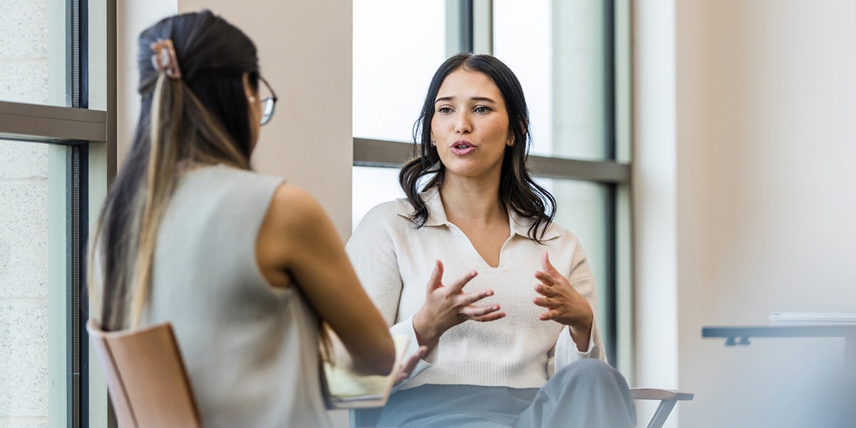 patient speaking with clinician